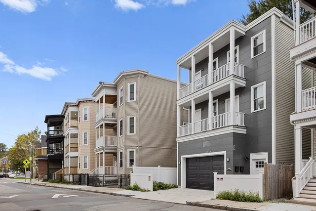 a view of a wooden deck with a yard