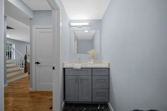 a bathroom with a sink and a mirror