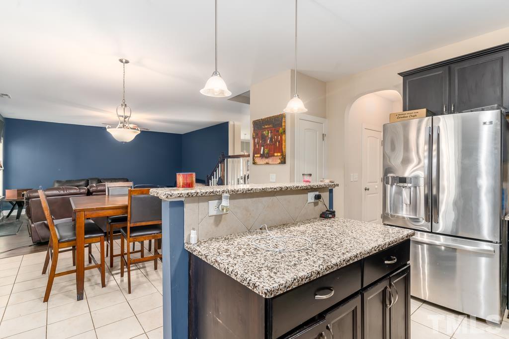 40 Cromwell Circle Cameron, NC 28326 - Photo 17 of 23 a kitchen with refrigerator and chairs