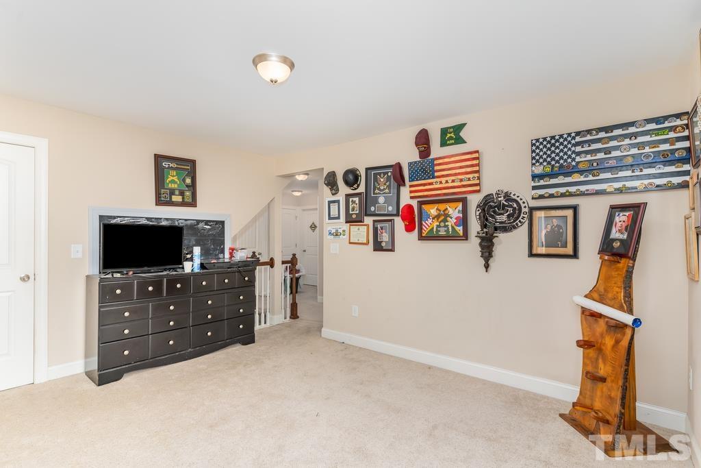 40 Cromwell Circle Cameron, NC 28326 - Photo 20 of 23 a bedroom with a bed and a television in it