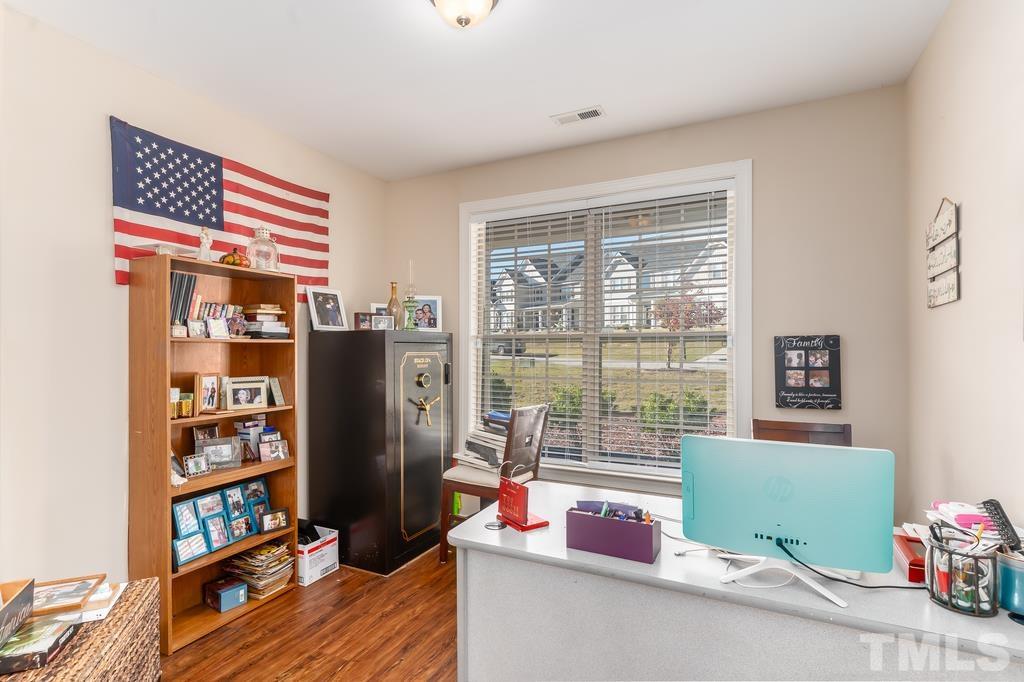 40 Cromwell Circle Cameron, NC 28326 - Photo 7 of 23 a living room with furniture and a book shelf