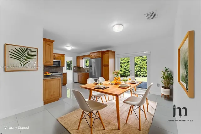 a dining room with furniture and window