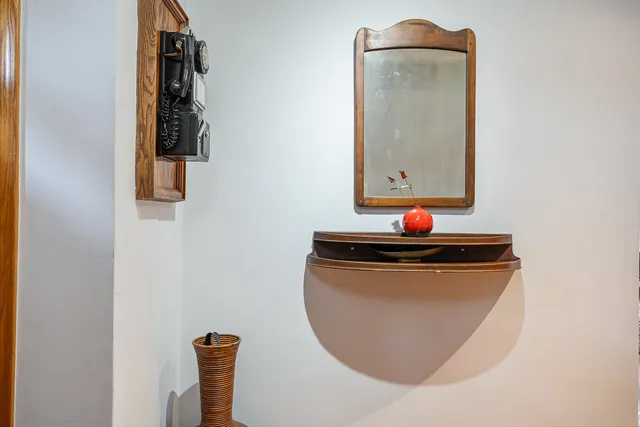 a kitchen with kitchen island granite countertop a sink and wooden floors