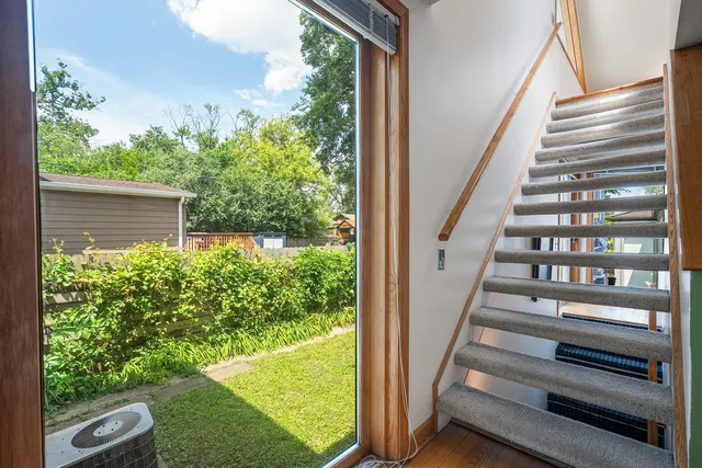 a view of a living room that has a fireplace