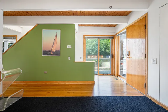 a view of a livingroom with furniture and staircase