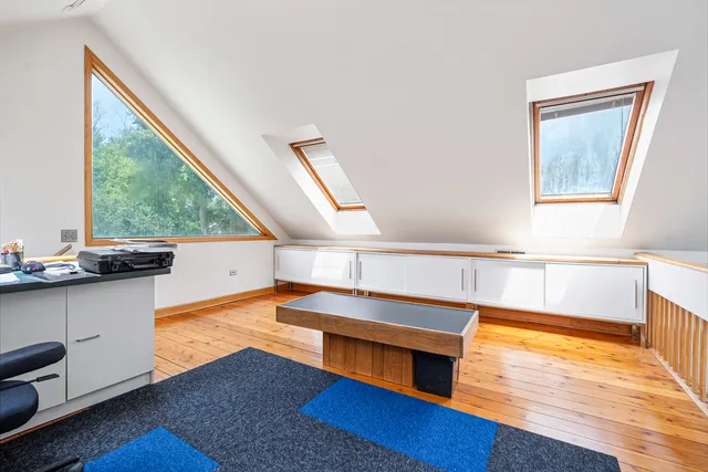 a view of a hallway with windows