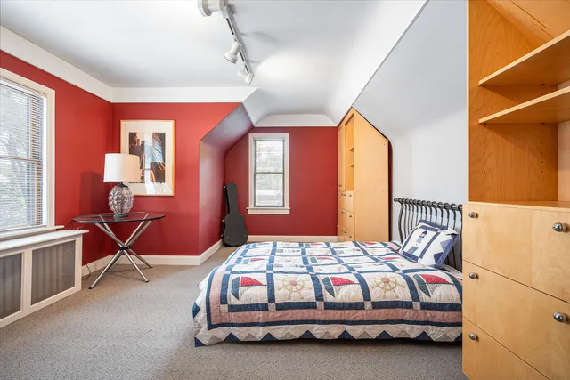 a bedroom with furniture and a chandelier