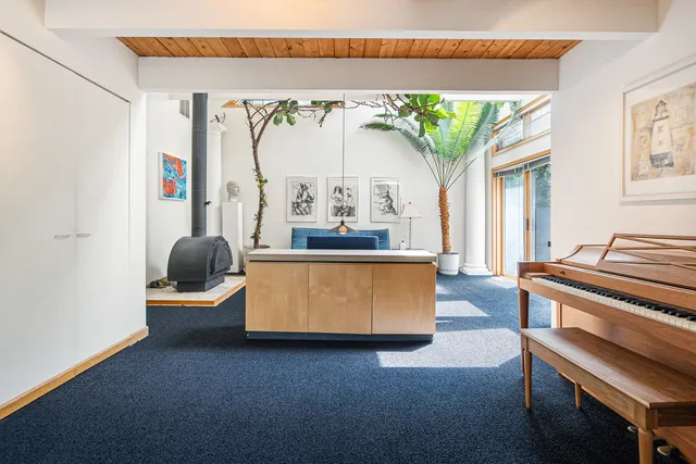 a living room with a table and chairs