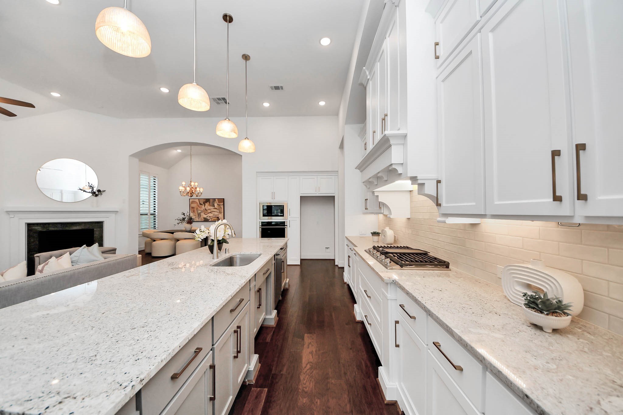 4310 Bakers Cove Manvel, TX 77578 - Photo 19 of 47 Hidden under the cabinets are two pull-down magnetic knife storage systems