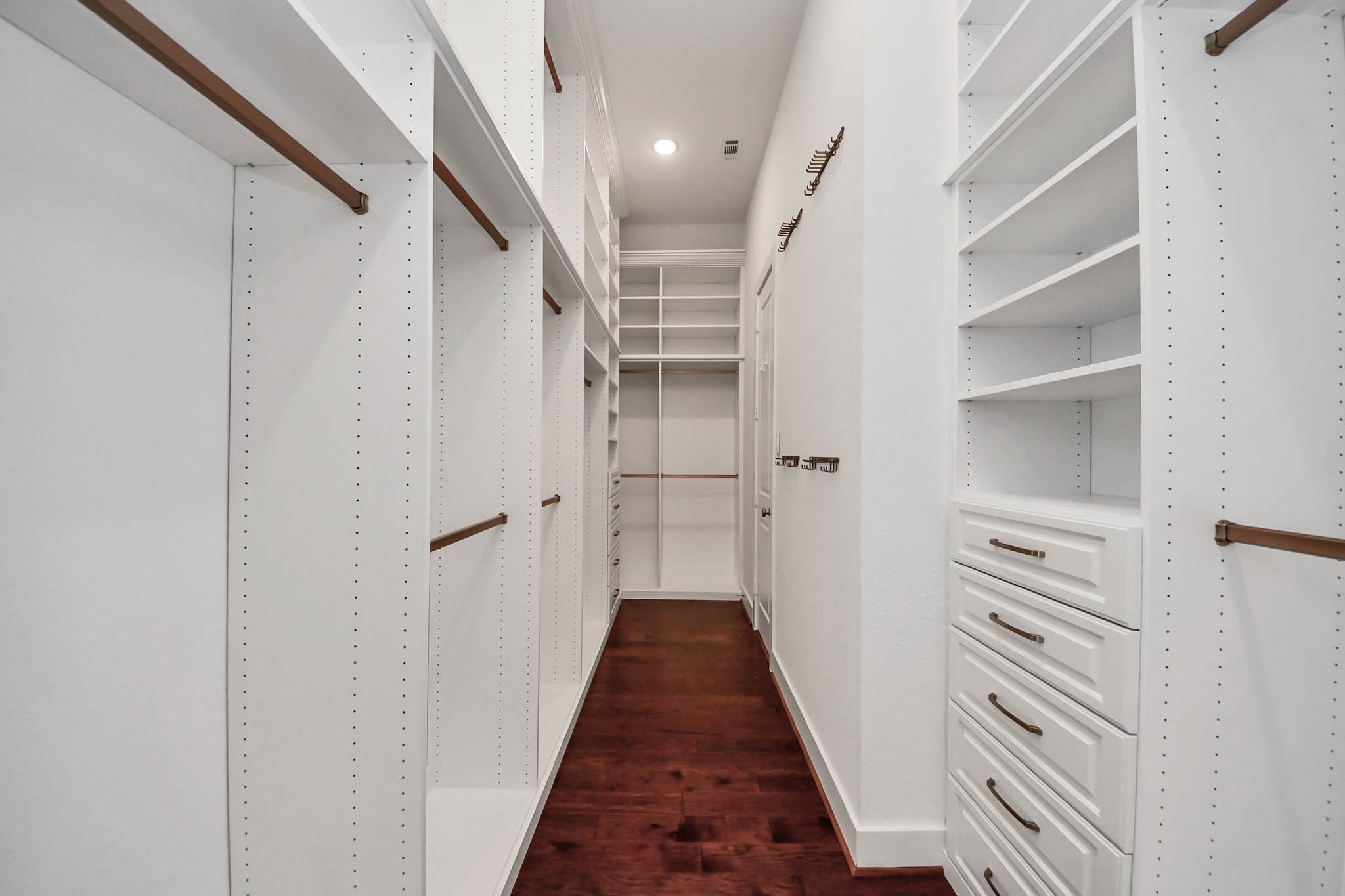 4310 Bakers Cove Manvel, TX 77578 - Photo 30 of 47 Massive floor to 12' ceiling custom primary closet by The Closet Factory