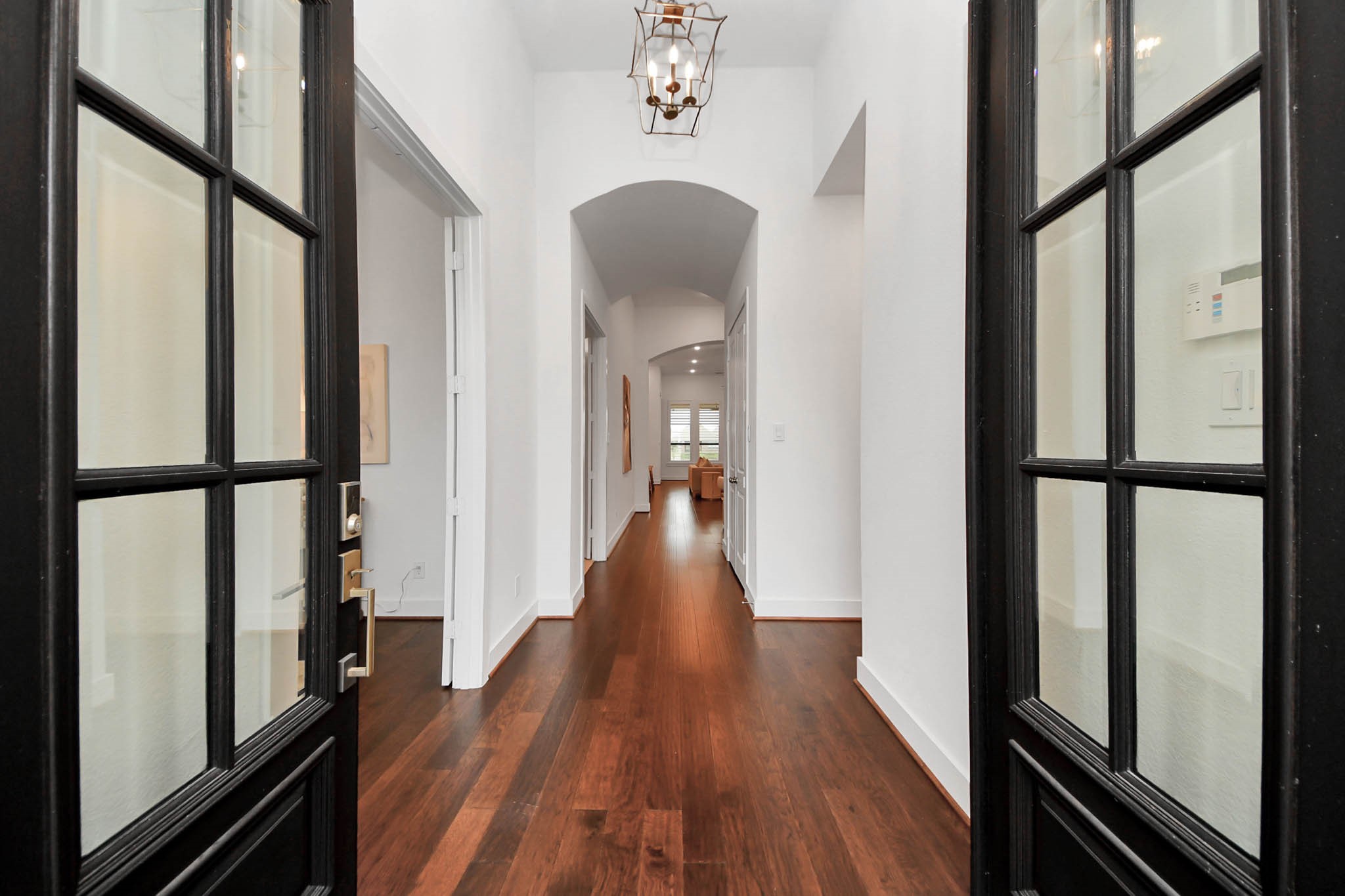 4310 Bakers Cove Manvel, TX 77578 - Photo 3 of 47 As you enter the front door, the home office is on the left and the entrance to the front bedroom with en suite bath is on the right