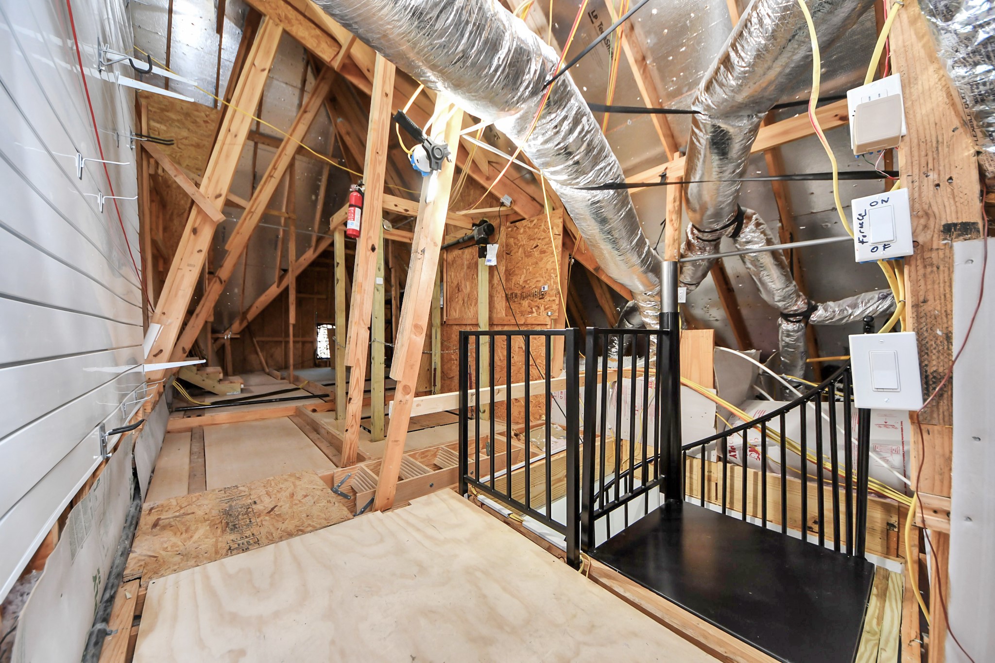 4310 Bakers Cove Manvel, TX 77578 - Photo 39 of 47 This attic view from the top of the spiral staircase shows a fraction of the extensive floored attic space.