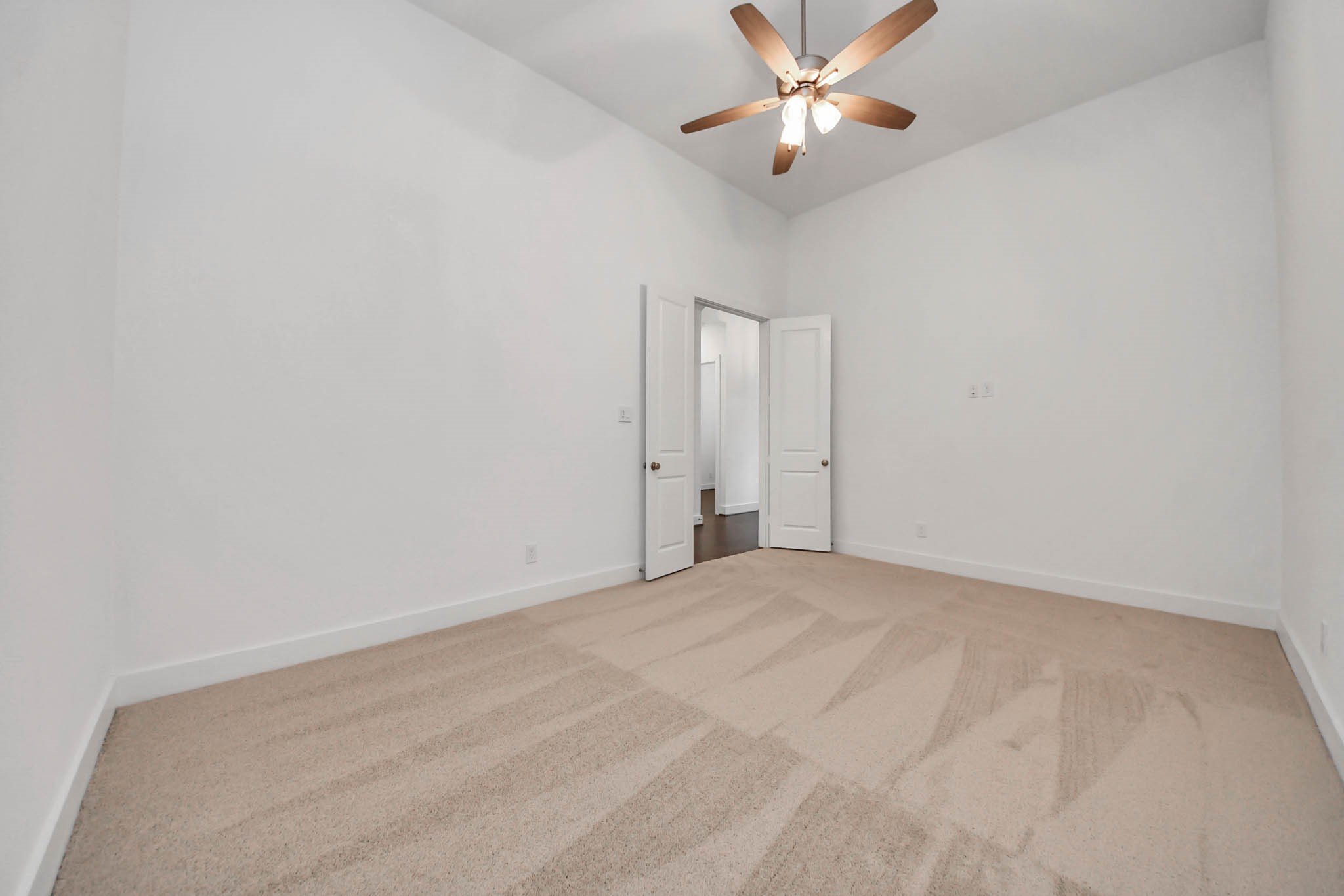 4310 Bakers Cove Manvel, TX 77578 - Photo 7 of 47 The flex room is beyond the home office and can be used as a media room, playroom, or home gym