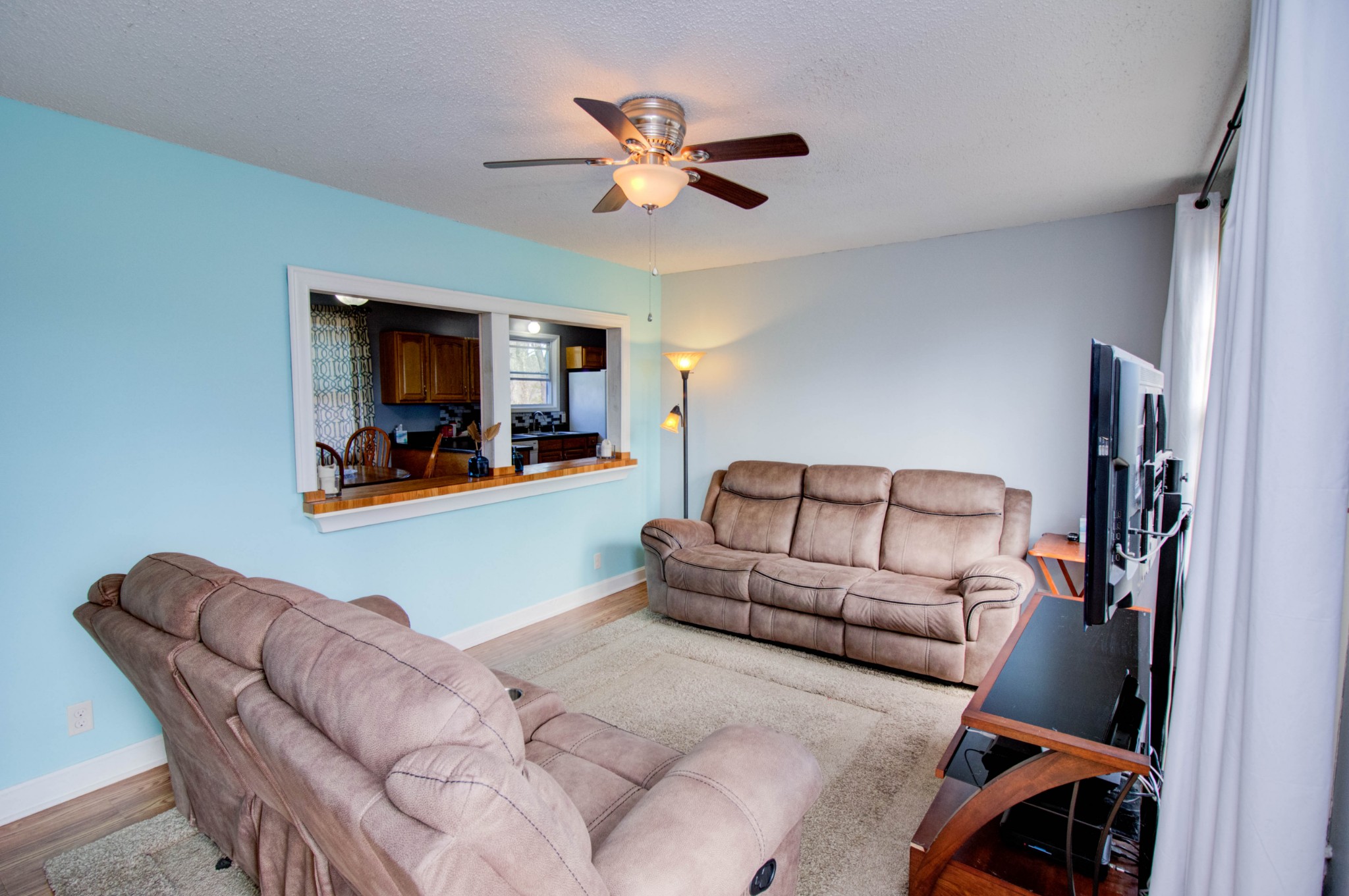 1409 5th Avenue West Springfield, TN 37172 - Photo 2 of 41 a living room with furniture and a ceiling fan