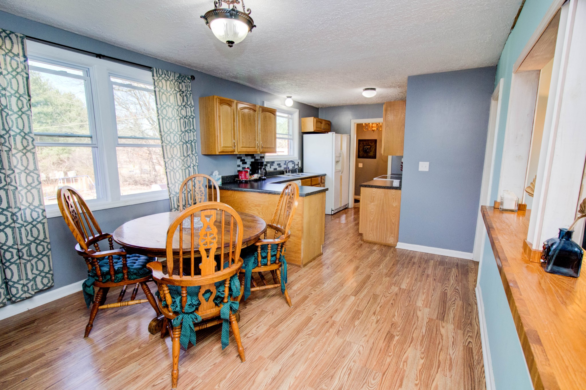 1409 5th Avenue West Springfield, TN 37172 - Photo 11 of 41 a dining room with furniture and wooden floor