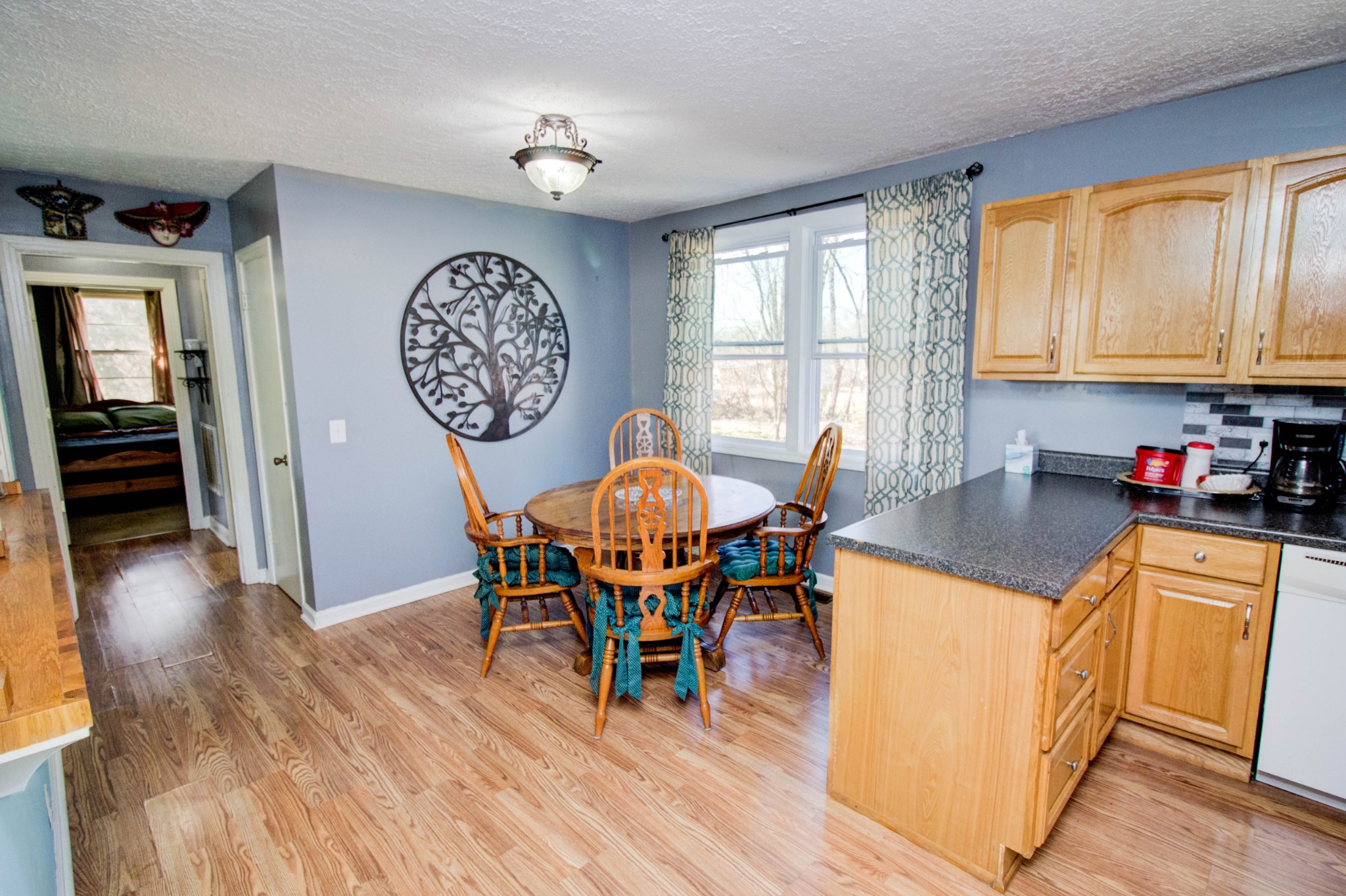 1409 5th Avenue West Springfield, TN 37172 - Photo 13 of 41 a view of a dining room with furniture window and wooden floor