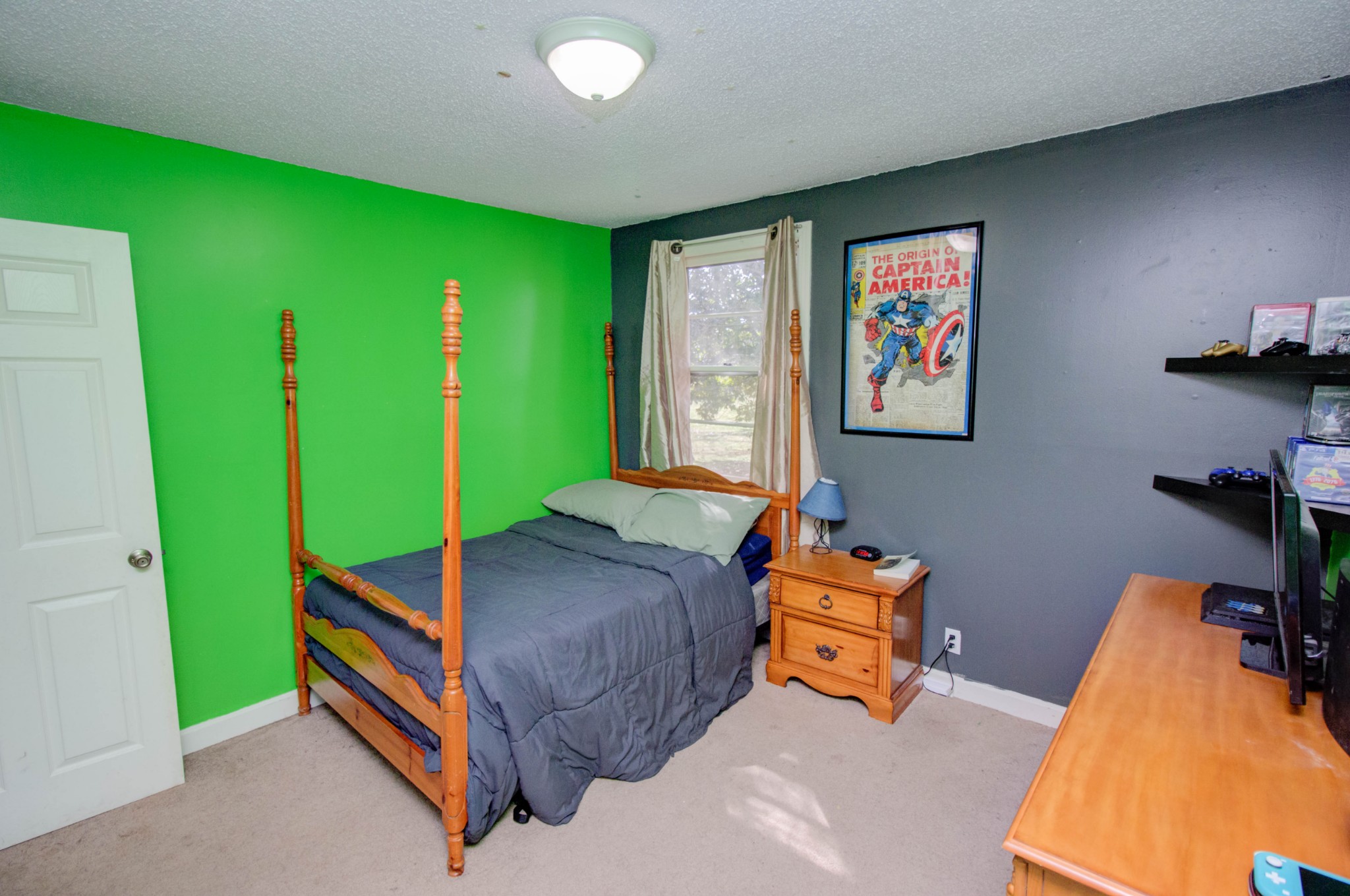 1409 5th Avenue West Springfield, TN 37172 - Photo 30 of 41 a room with furniture and a flat screen tv