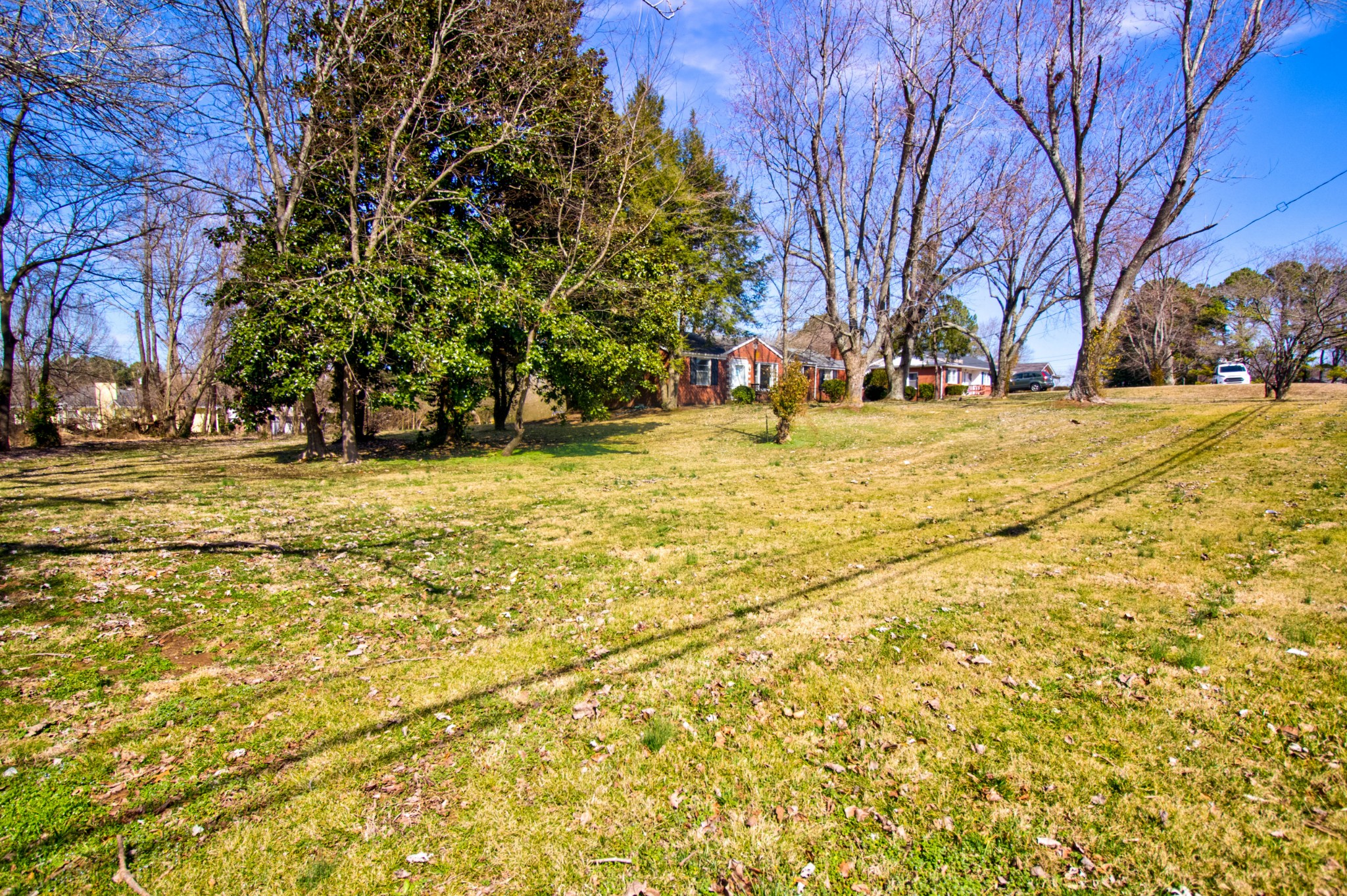 1409 5th Avenue West Springfield, TN 37172 - Photo 32 of 41 a yellow house with trees in front of it