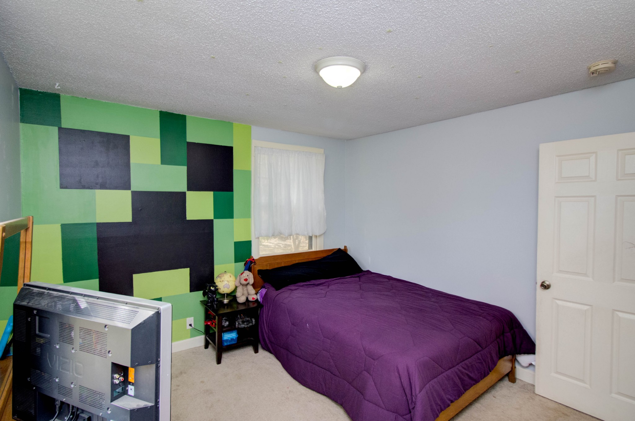 1409 5th Avenue West Springfield, TN 37172 - Photo 7 of 41 a bed room with a bed and a chair