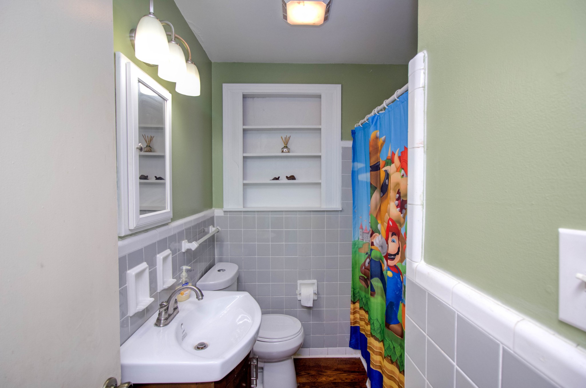 1409 5th Avenue West Springfield, TN 37172 - Photo 9 of 41 a bathroom with a sink and a mirror