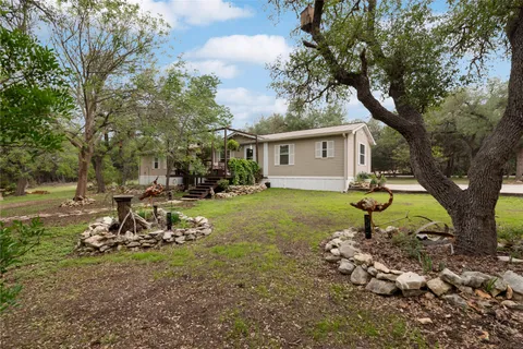 a backyard of a house with lots of green space