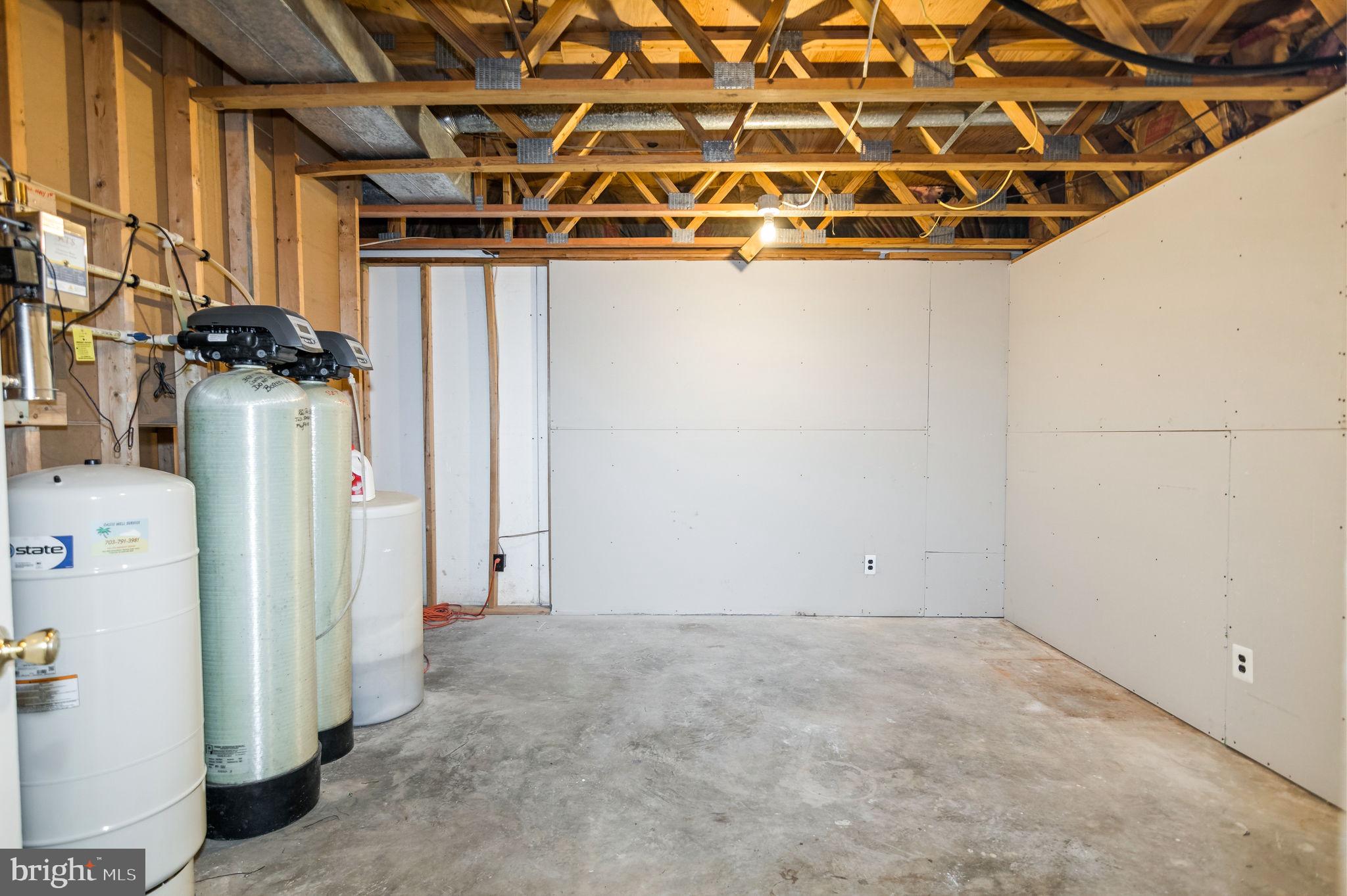 13593 Bethel Road Manassas, VA 20112 - Photo 45 of 54 Large storage/utility room with water treatment