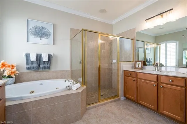 a bathroom with a bathtub a sink and a shower