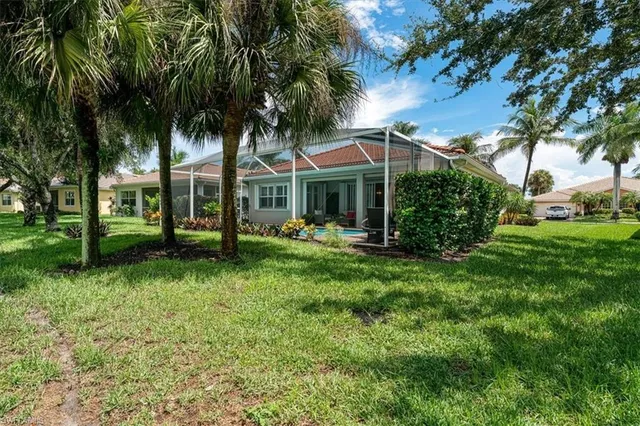 a view of a house with a yard porch and sitting area