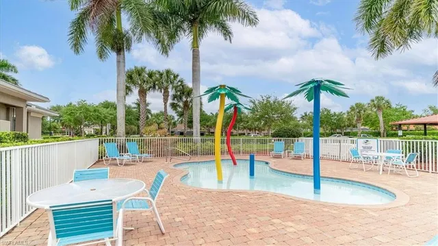 a view of a swimming pool with a patio