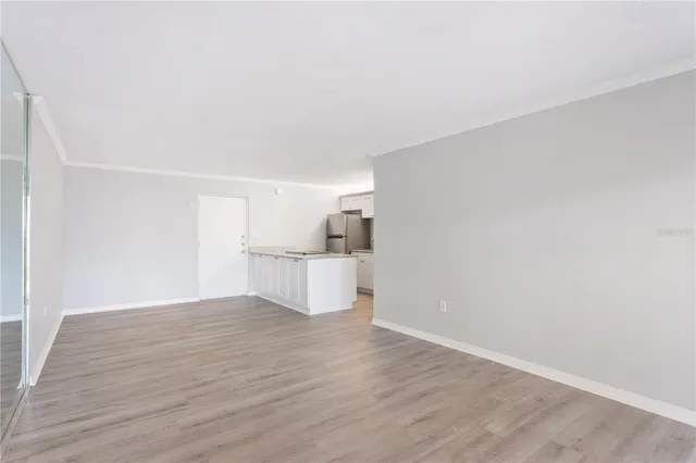 a view of a kitchen with wooden floor