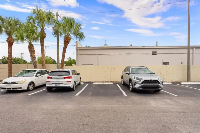 a view of cars parked in front of a building