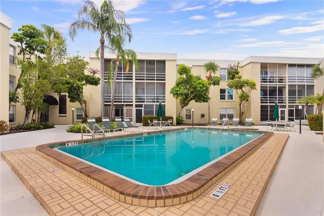 a view of a swimming pool with a patio
