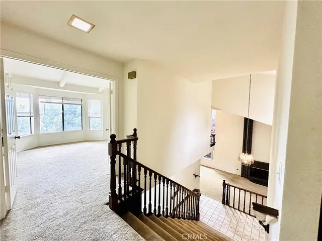 a view of a hallway with windows