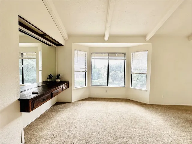 a large kitchen with granite countertop a stove a sink and dishwasher
