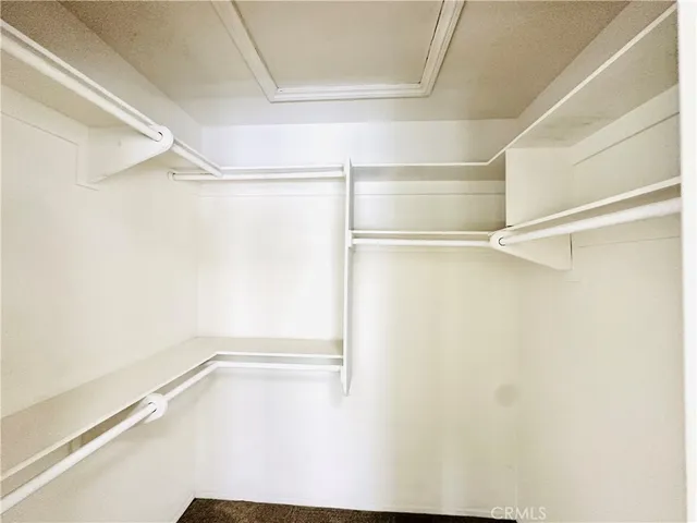 a view of an empty walk in closet