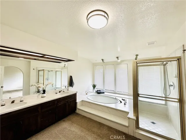 a bathroom with a double vanity sink mirror and double