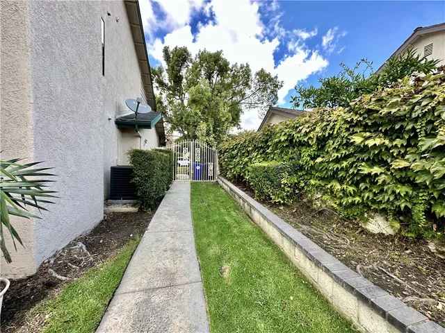 a view of a garden with wooden bridge