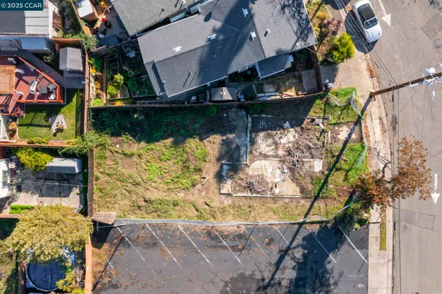 a view of a terrace with lawn chairs