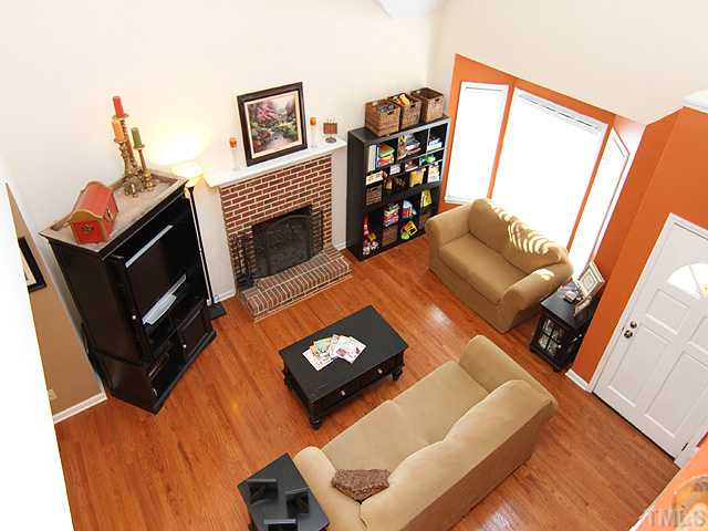 2016 Osbourne Court Raleigh, NC 27604 - Photo 3 of 15 GREAT ROOM FEATUES COZY FIREPLACE, DRAMATIC SOARING CEILINGS, PALADIAN WINDOW. THIS ROOM IS DRENCHED IN SUNLIGHT. hANDSOME, RICH HARDWOODS!