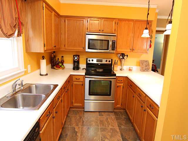 2016 Osbourne Court Raleigh, NC 27604 - Photo 6 of 15 EASY STEP KITCHEN WITH GREAT COUNTERS AND PANTRY. CHECK OUT THE STAINLESS APPLCS. AND UPGRADED FLOORING.