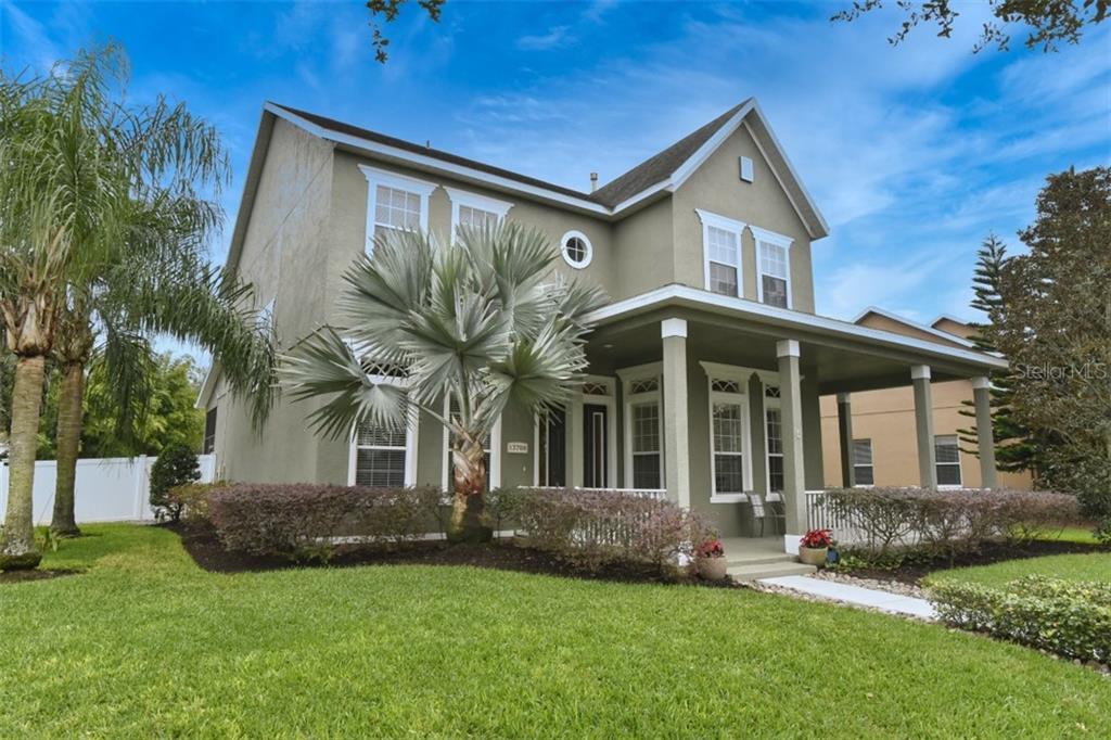 13708 Bluebird Pond Road Windermere, FL 34786 - Photo 1 of 1 a front view of a house with a yard