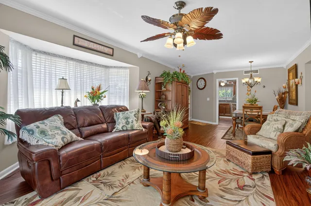 a living room with furniture and a table