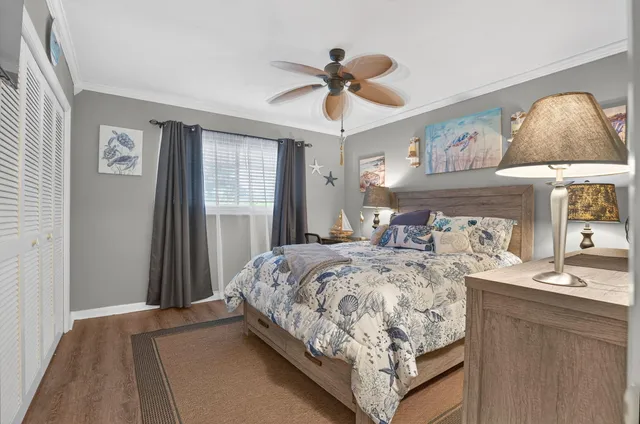 a bedroom with bed and window