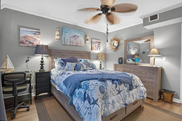 a bed room with a bed and a chandelier