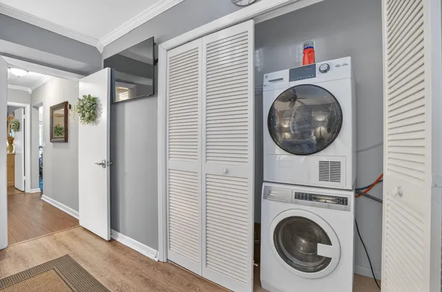 a view of a hallway with washer and dryer