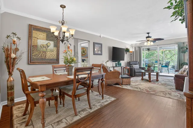 a view of a dining room with furniture window and outside view