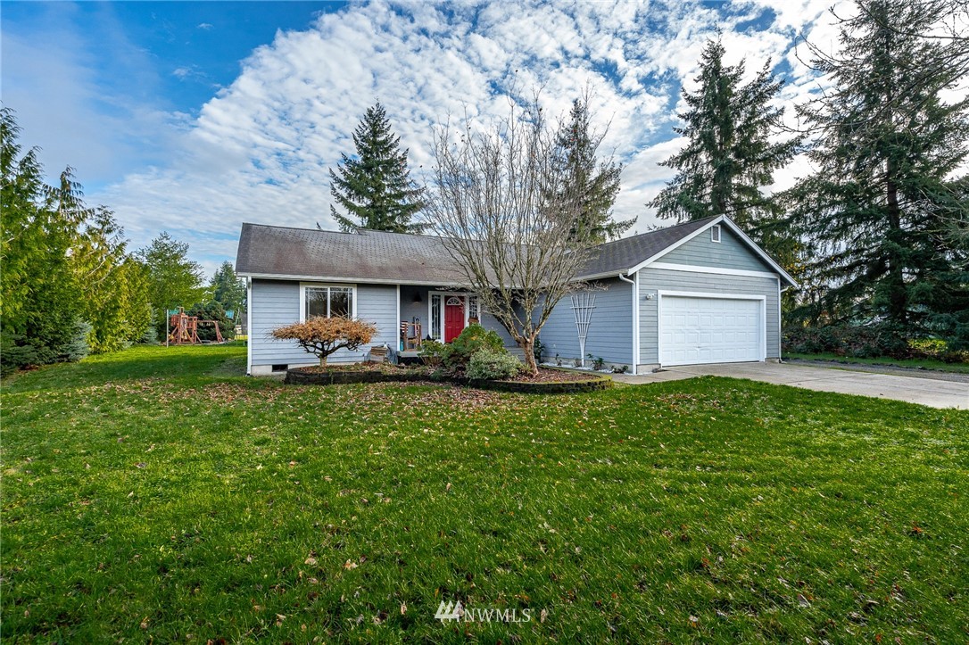 18036 Daryl Lane Southwest Rochester, WA 98579 - Photo 2 of 40 a front view of a house with garden