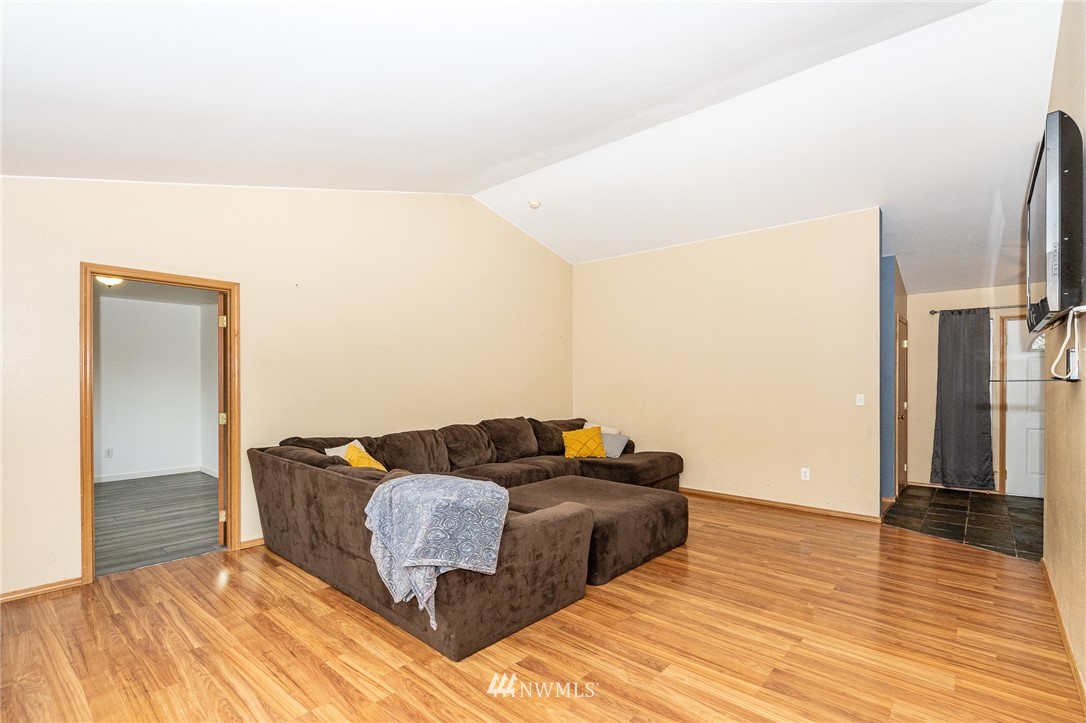 18036 Daryl Lane Southwest Rochester, WA 98579 - Photo 13 of 40 a living room with furniture and a wooden floor