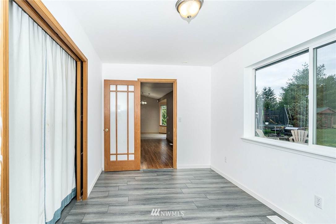 18036 Daryl Lane Southwest Rochester, WA 98579 - Photo 15 of 40 a view of a hallway with wooden floor and a window