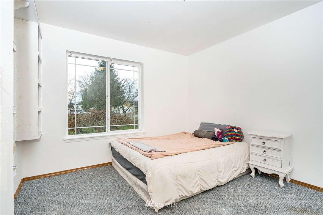 18036 Daryl Lane Southwest Rochester, WA 98579 - Photo 20 of 40 a bedroom with a bed and a window